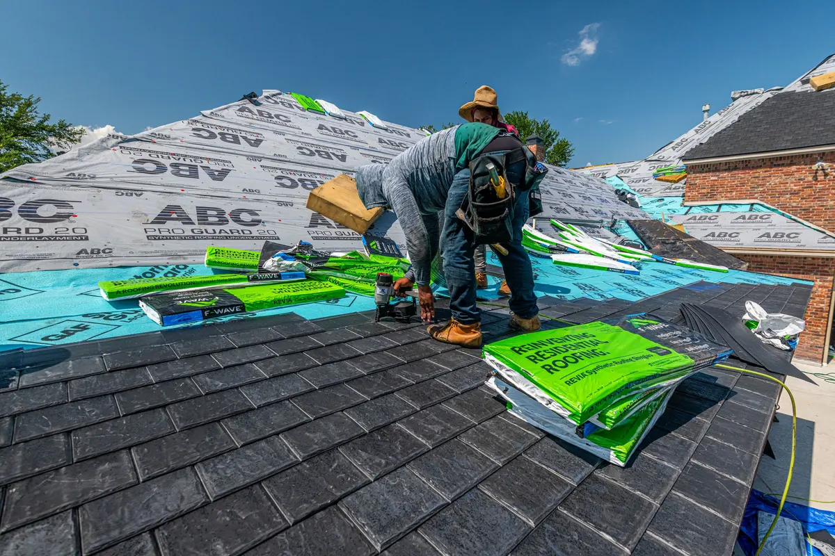 Roofing crew working on a roof, representing the Reyes Roofing team in Los Angeles, CA